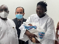 Mother of the symbolic 8 billionth baby with Mr Barnabas Tisa and others at the Ridge Hospital