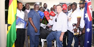 Azumah Nelson CEO of Geodrill Limited, Dave Harper presented boxing equipment to the team