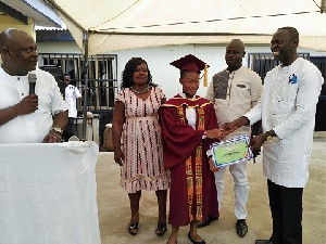 Kweku Addo watch on as certificates were given to students