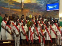 Most Reverend Charles Gabriel Palmer Buckle with some youths of St James Catholic Church