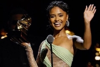 South African musician, Tyla holding her Grammy award