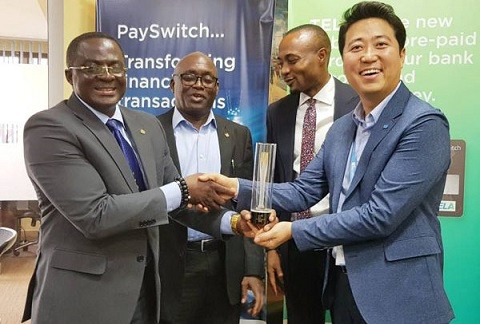 GOC boss, Nunoo-Mensah (L) in a handshake with Payswitch