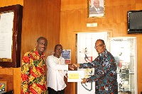 Mr Sowah (Right) presenting cheque to Mr Laryea