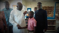 Joseph Kofi Adda with the 12-year-old boy