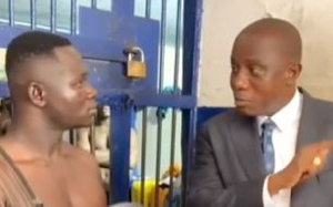 Former Defence Minister Dominic Nitiwul (L) confronting the 'fake soldier'