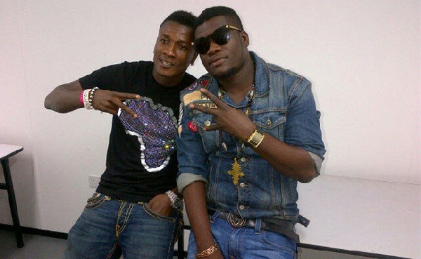 Asamoah Gyan with his colleague Castro