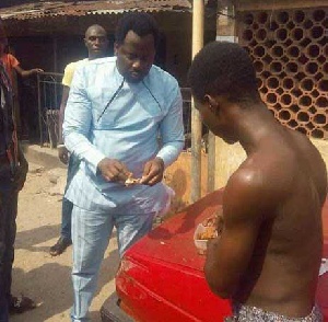 Desmond Elliot was spotted eating bread and beans with a young man.