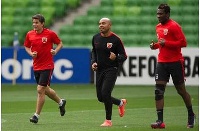 Dario Conca (left) and Asamoah Gyan (right) are put through their paces