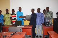 1986 year group of Obuasi Secondary Technical giving laptops to the school's leadership