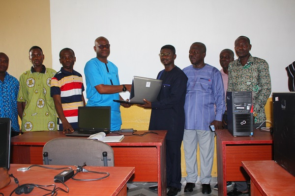 1986 year group of Obuasi Secondary Technical giving laptops to the school's leadership