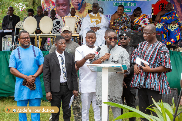 Dr Kwamigah-Atokple (with mic) speaking at the event and flanked by others