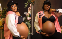 MzGee showing off her baby bump