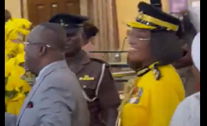 Justice Baffoe-Bonnie (L) and wife (behind him )