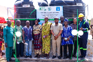 Executive Director of CFF-Ghana, Richard Kasu (3rd to the right), with leaders of the community