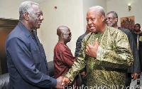 Presidents Kufuor and Mahama exchange pleasantries at a public event