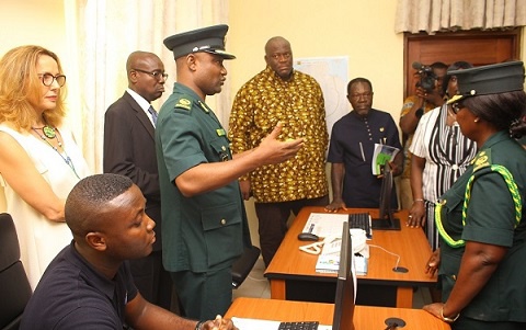 Assistant Commisioner of Immigration, Samue Basantale briefing some dignitaries about the facility