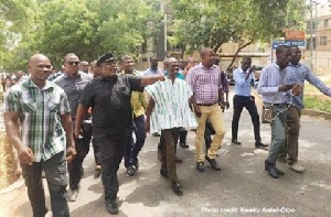 Koku Anyidoho clad in black and prancing on the streets as he headed to the Police CID headquarters