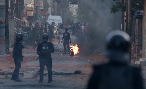 Demonstrators clash with police in Dakar. [Leo Correa/AP Photo]