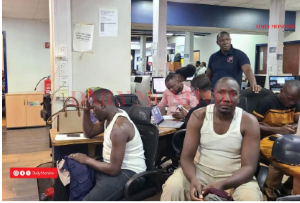 Journalists Raymond Tamale (L), Abubaker Lubowa (R) and Denis Kabugo (standing) were attacked