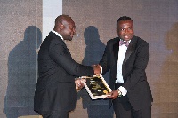 Dr. Edem Bart Williams receiving his award