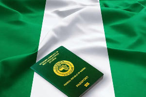 Nigerian passport on a national flag | File photo