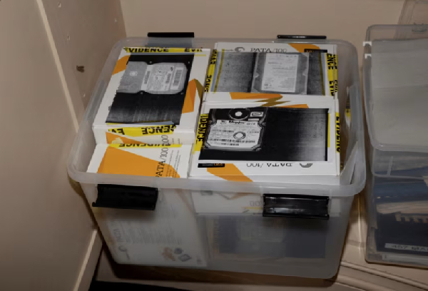 Material marked with evidence tape inside the home of Jeffrey Epstein