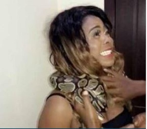 Kisa Gbekle with the snake around her neck