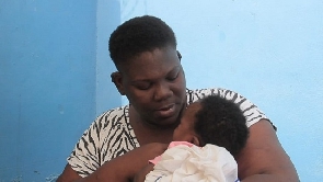 A picture of 32- year- old Blessing with her daughter