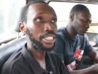 Jesse Samuel (in black polo shirt) arrested by residents over MoMo theft.