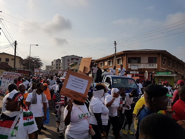 Scores of party supporters and executives are marching through the streets of Accra