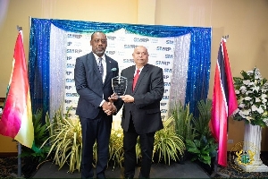 Dr Mathew Opoku Prempeh (L) receiving the award