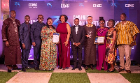 Some managers and staff of GCB Bank displaying their citations and shield