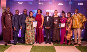 Some managers and staff of GCB Bank displaying their citations and shield