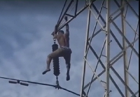 The victim of Kasoa electrocution hanging on an electric pylon
