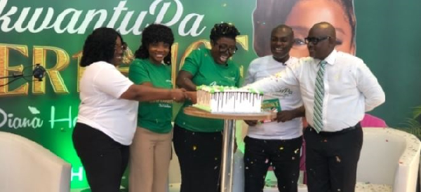 Diana Hamilton (middle) and other dignitaries cutting the cake at the launch