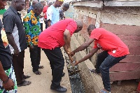 Some Ghanaians cleaning a gutter during a clean-up exercise