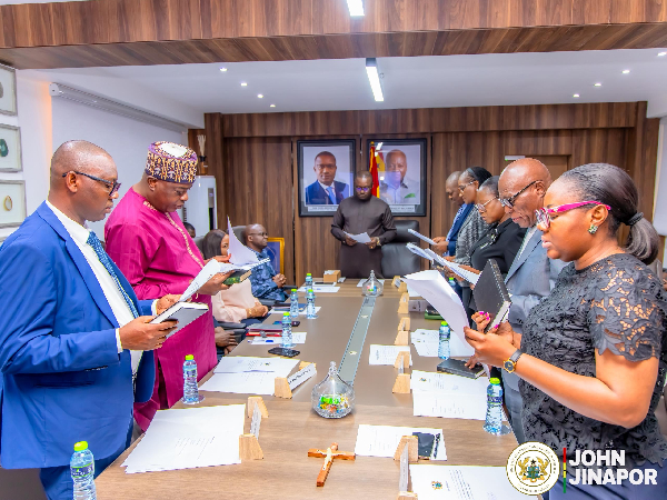 A photo of John Jinapor (middle) and members of the Energy Commission board