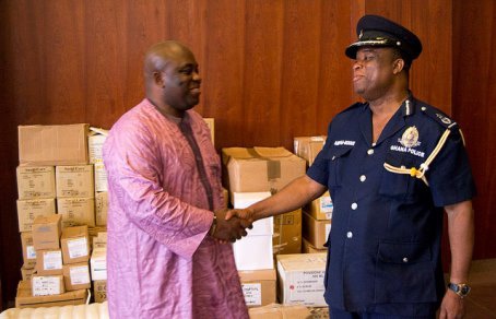 Dr Bampoe shakes DCOP Ampah Benin Director General Public Affairs of the Ghana Police Service