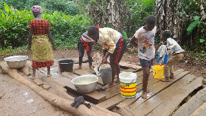 Some residents of Fanteakwa South District fetching water from a stream