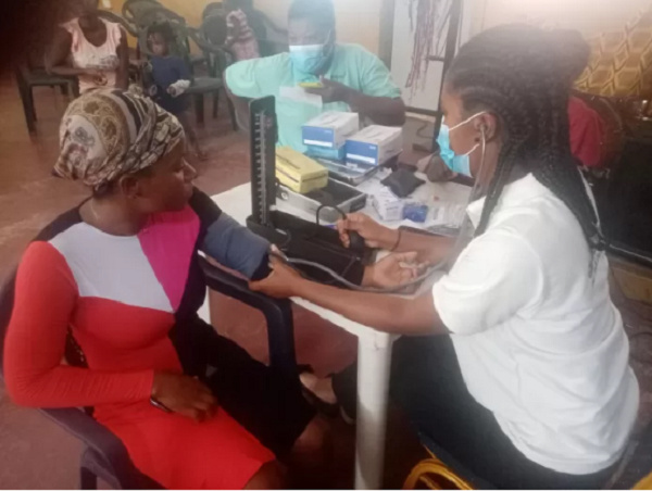 A resident of Tema going through a health screening