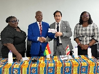 Ambassador of Lebanon to Ghana H.E Maher Kheir presenting the cheque