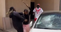 The video depicted her smashing the windshield of a car belonging to Theo Vesachi
