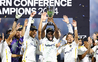 Joseph Painstil celebrating with the Western Conference Trophy