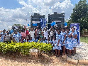 Some of the students by the water tankers