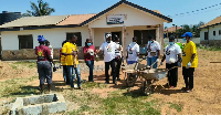 Abraham Aiddo among other officials at the facility