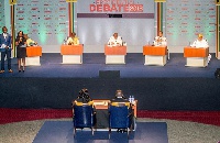 Presidential candidates seated for the debate