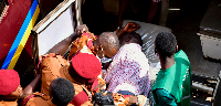 Kizza Besigye is put in an ambulance after he collapsed while attending a court session