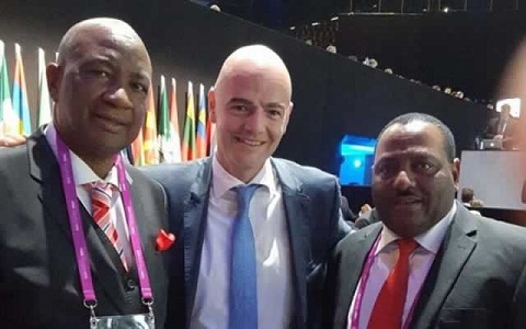 ZIFA president Philip Chiyangwa (left) poses for a picture with new FIFA president Gianni Infantino
