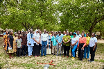 A group picture of members of the foundation and some farmers