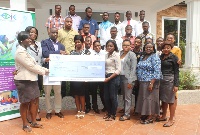 Global Communities presenting a check to the youth